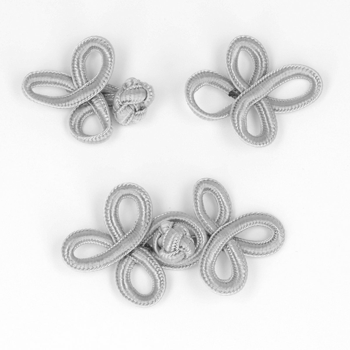 Grey frog clasp fastening