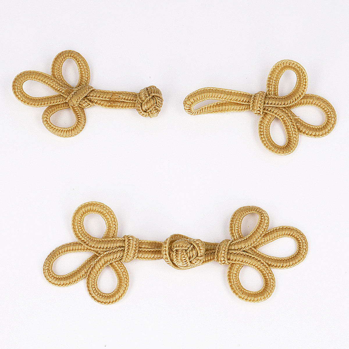 Beige frog clasp fastening