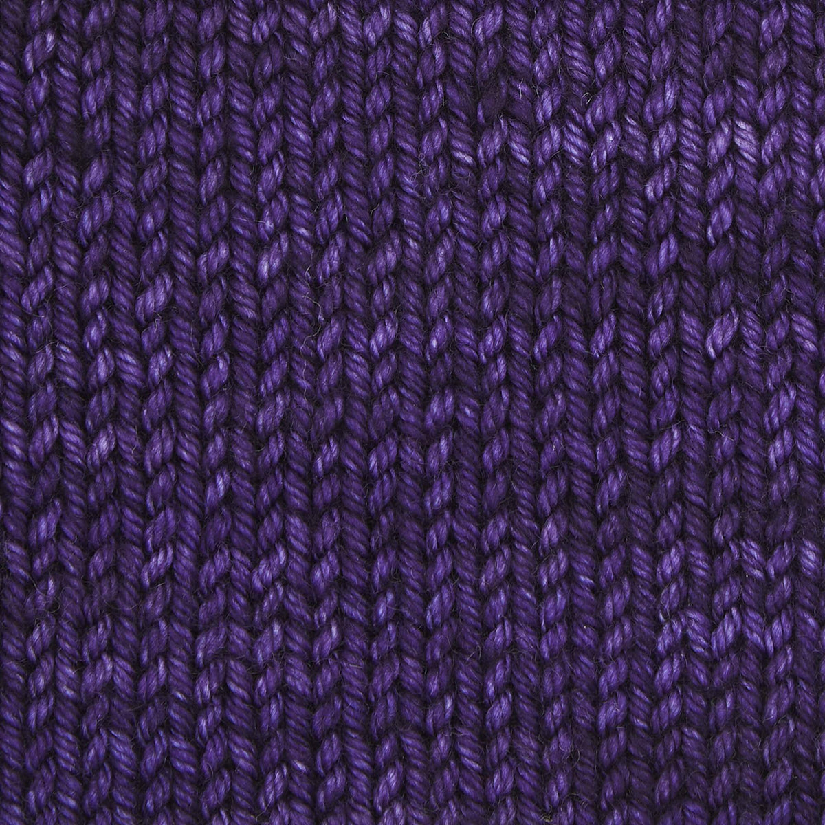 Skein of Symfonie Bella semi-solid merino yarn in Java Plum