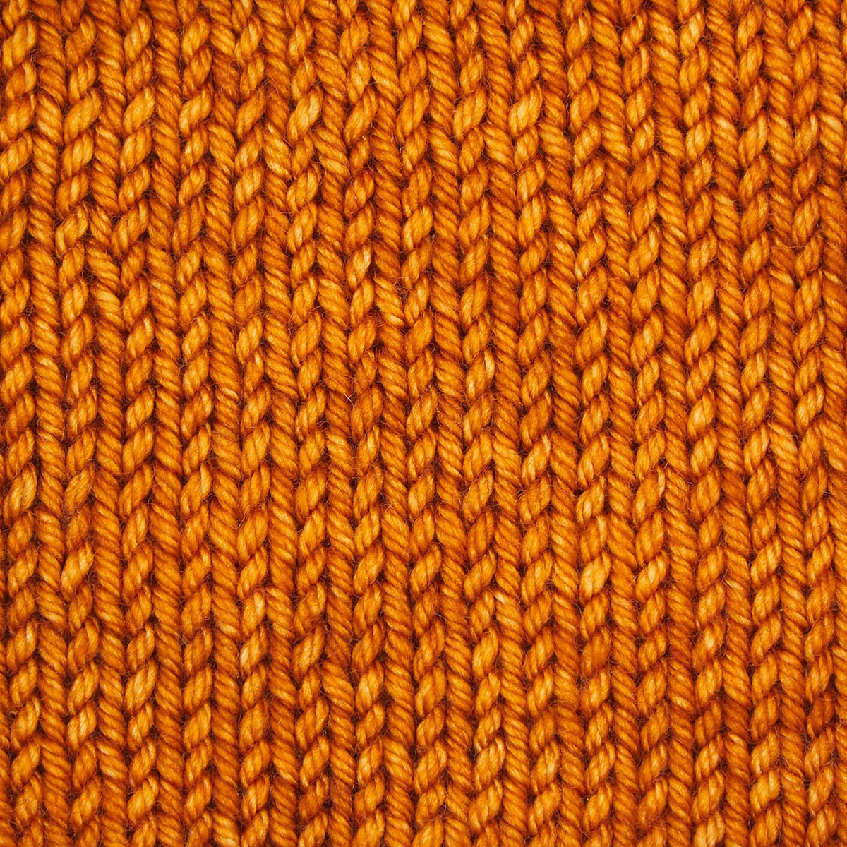 Skein of Symfonie Bella semi-solid merino yarn in Sunset