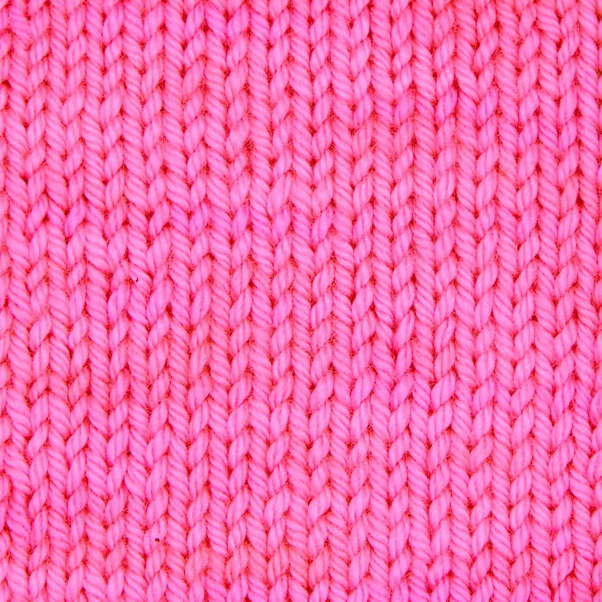 Skein of Symfonie Bella semi-solid merino yarn in Ka-Pow Pink