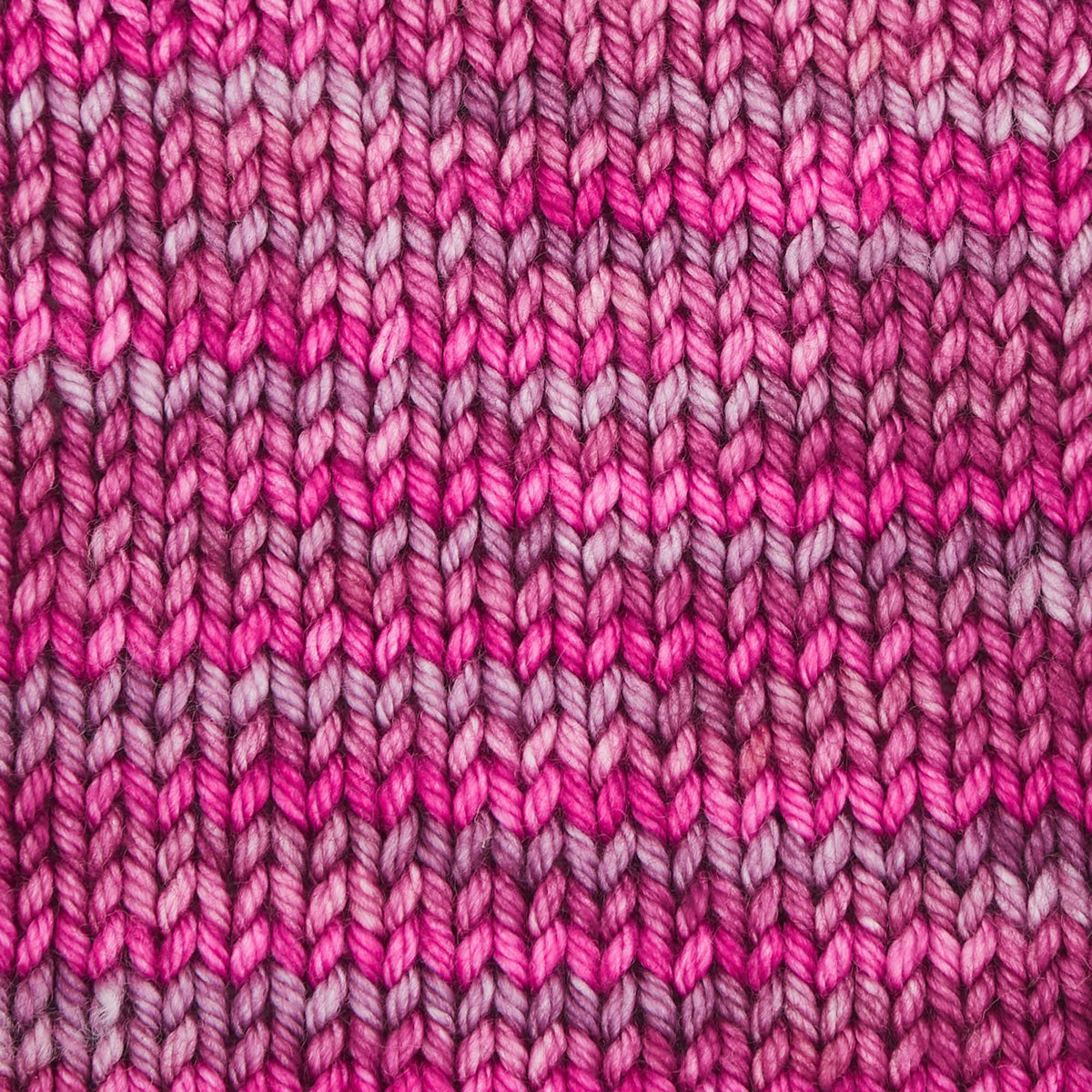 Skein of Symfonie Bella variegated merino yarn in Autumn Rose