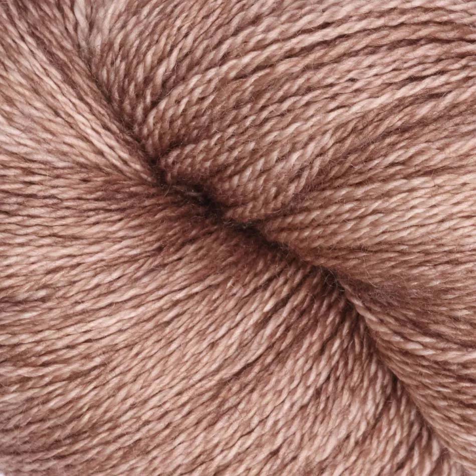Hand-dyed cake of Symfonie Diva yarn in Bronze