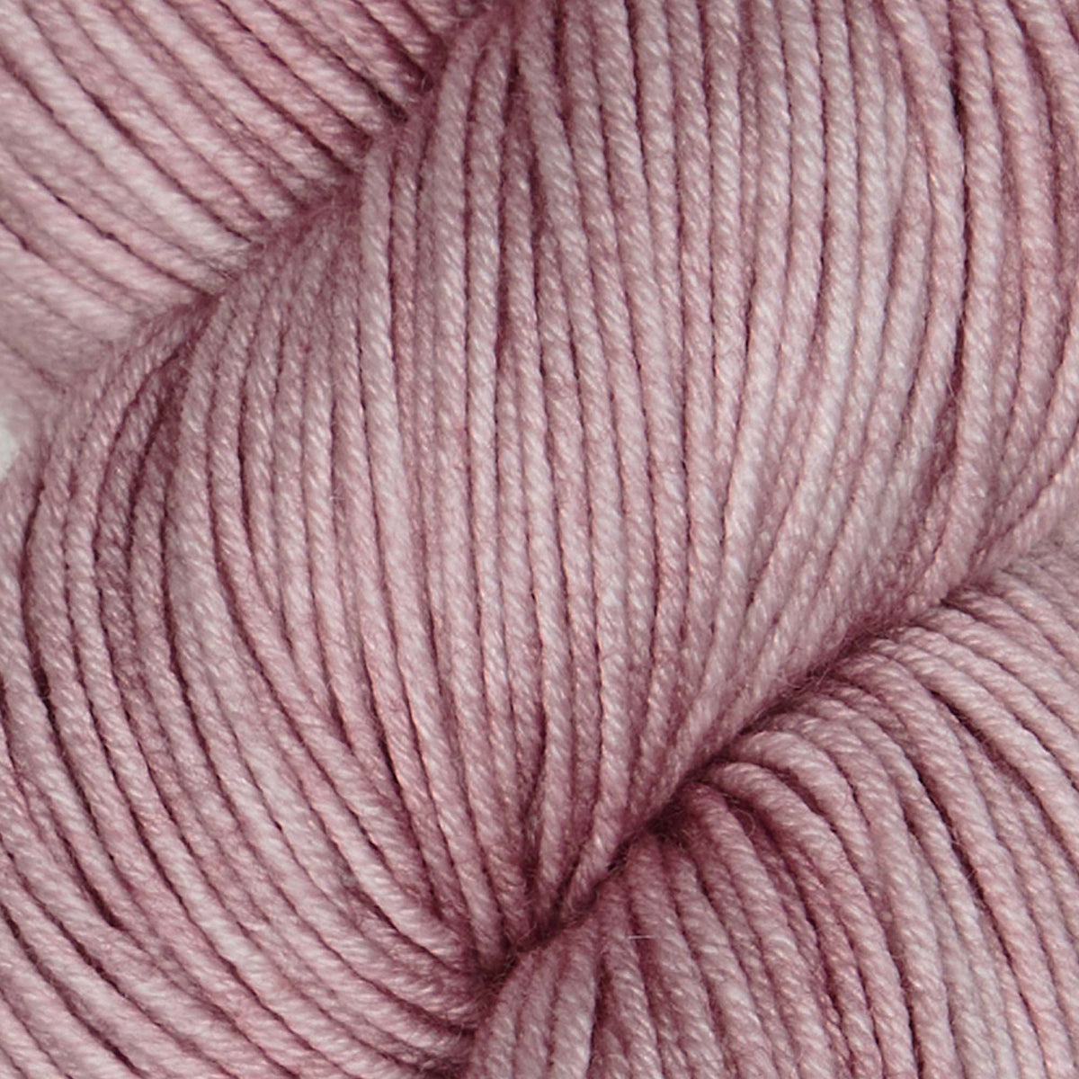 Skein of Symfonie Viva DK merino yarn in Pink Sandstone