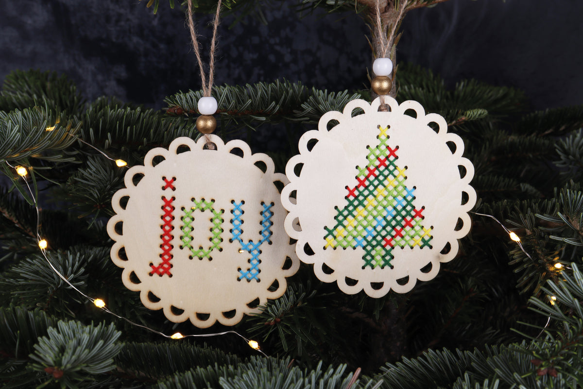 Pre-punched wooden Joy and Christmas tree shapes for cross stitch