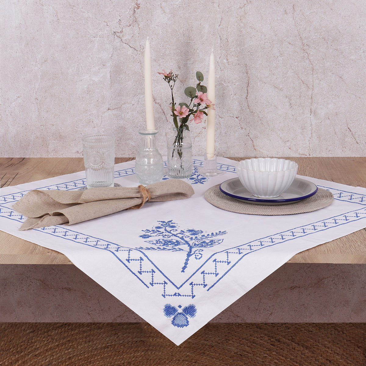 Cross stitched cotton tablecloth with blue floral design