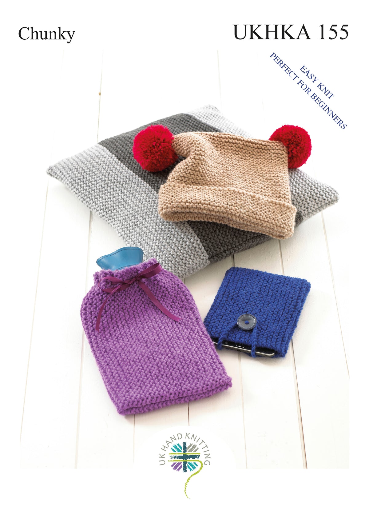 Cover of a UK Hand Knitting Association knitting pattern showing a hat, cushion, hot water bottle cover and phone cover