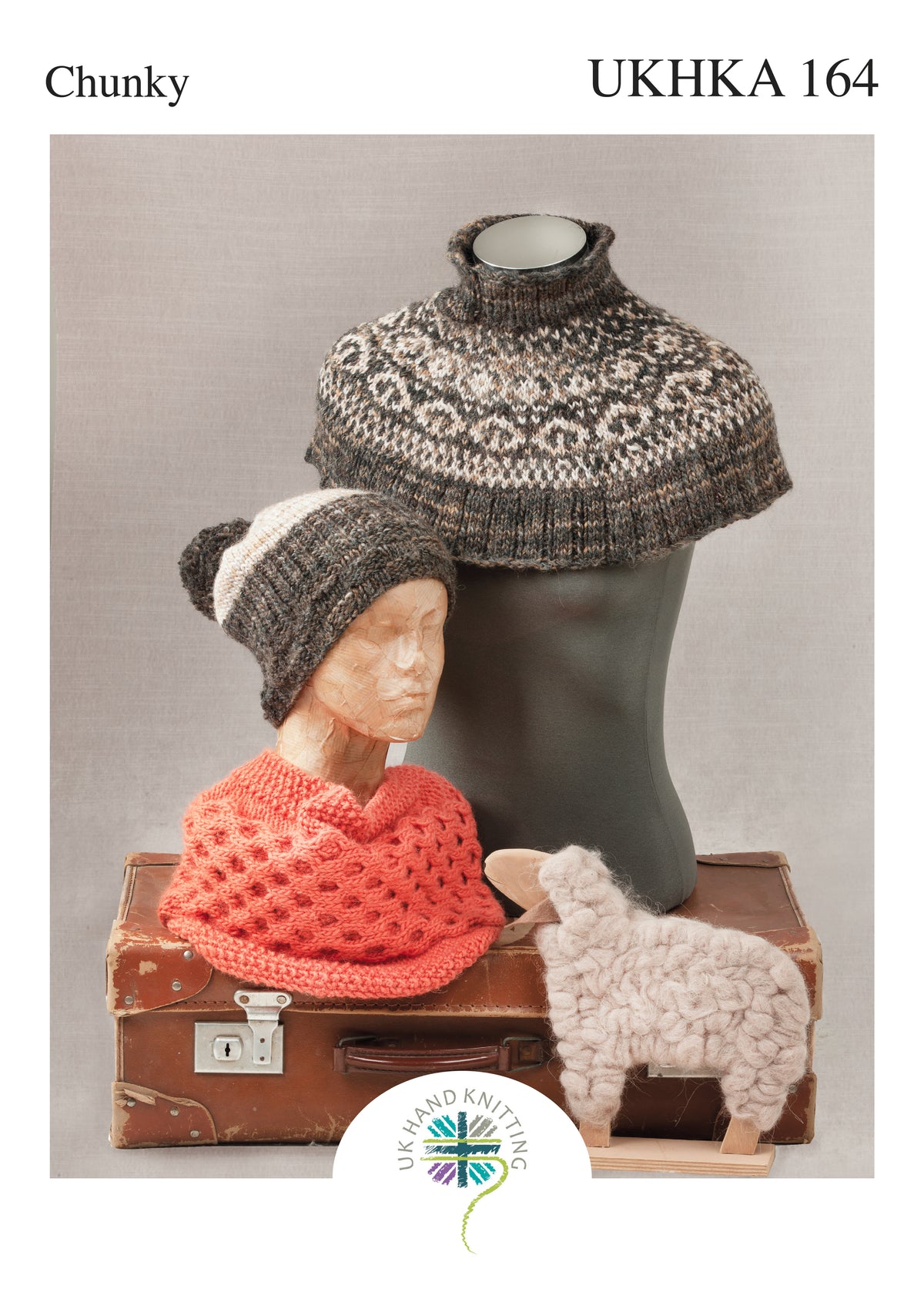 Cover of the UKHKA mini poncho and hat knitting pattern