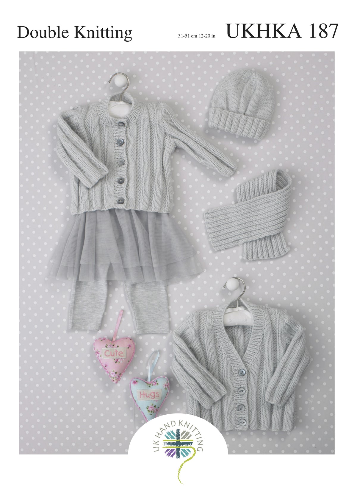 Cover of a UK Hand Knitting Association knitting pattern showing baby cardigans, a hat and a scarf