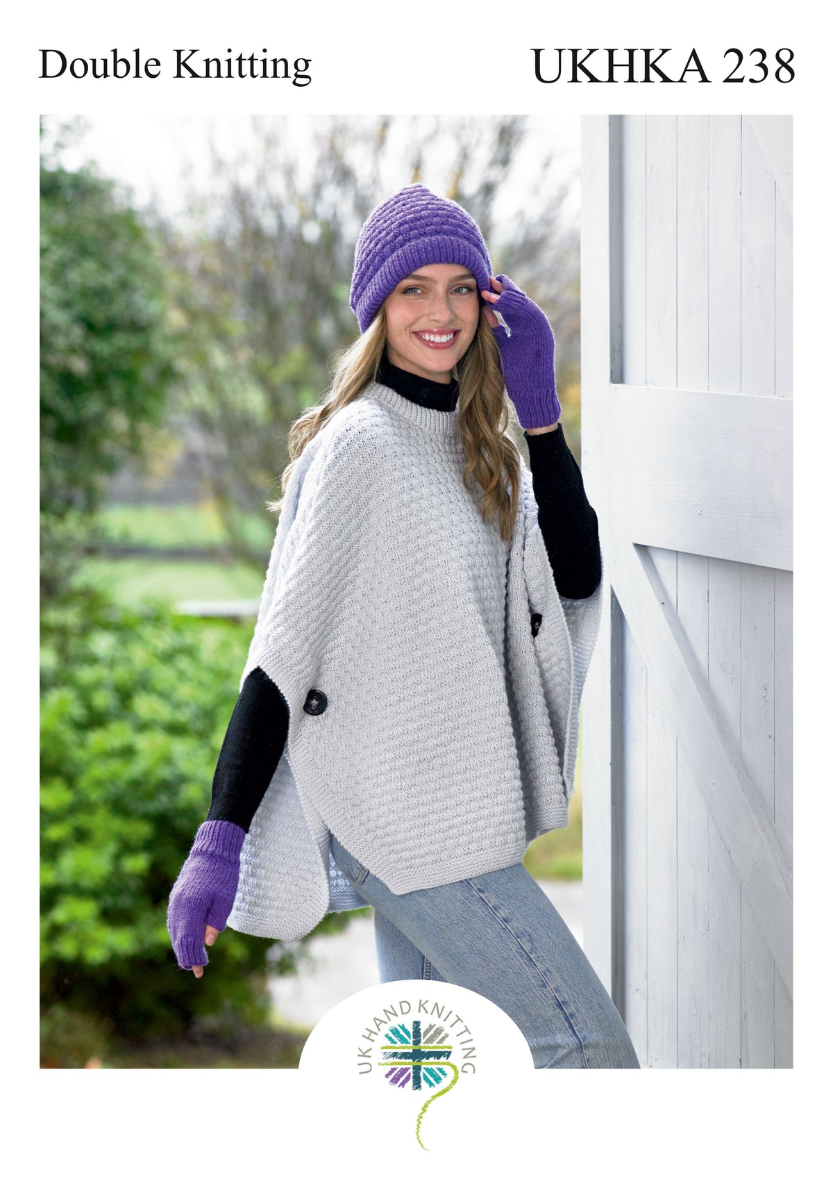 Cover of a UK Hand Knitting Association knitting pattern showing a hat, gloves and poncho