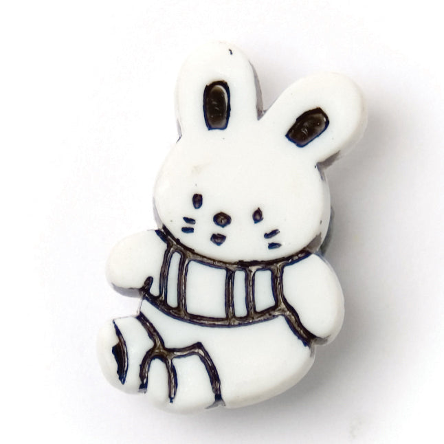 White rabbit-shaped novelty button with black detail, 21mm