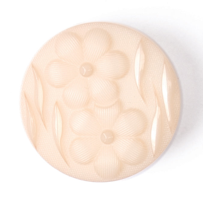 Round peach button with embossed flowers