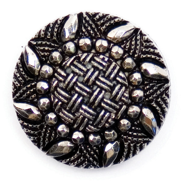 Ornate black and silver-tone button with a filigree pattern