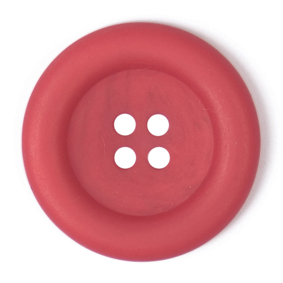 Coral red button with a wide raised rim