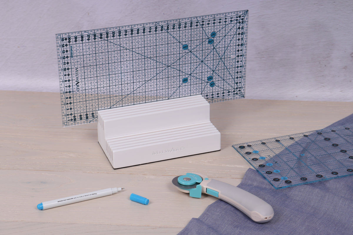 White wooden ruler rack with 10 slots