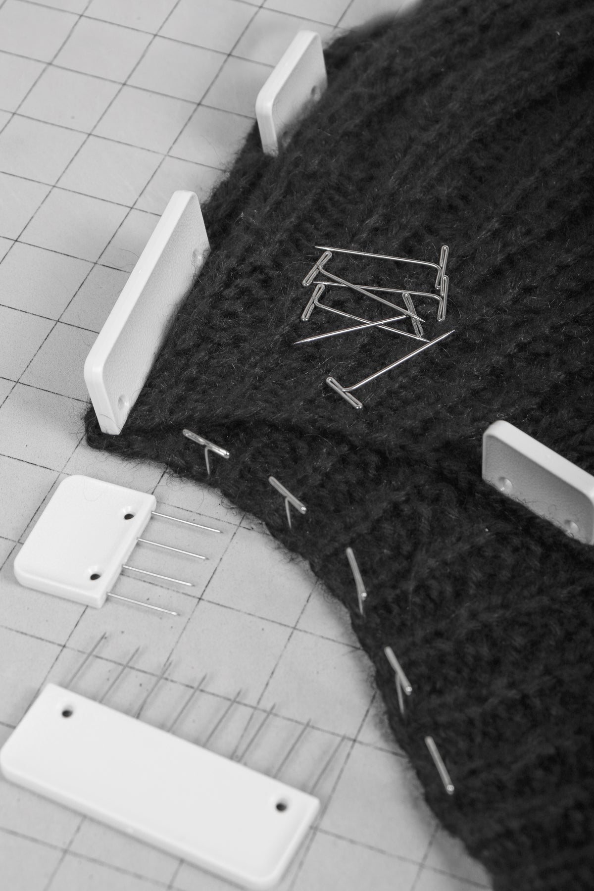 Knit blocking pins and T-pins in a plastic storage box