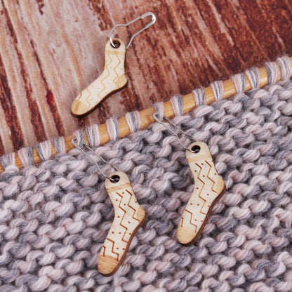 Tub of wooden woolly sock stitch markers on bulb pins