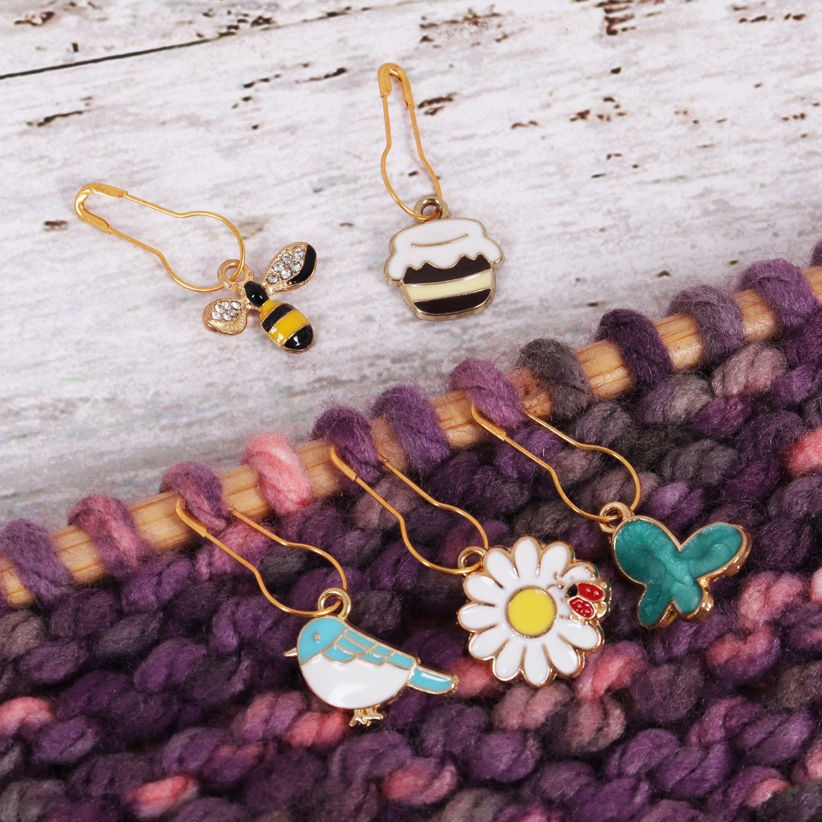 Tub of bee happy themed enamel charm stitch markers