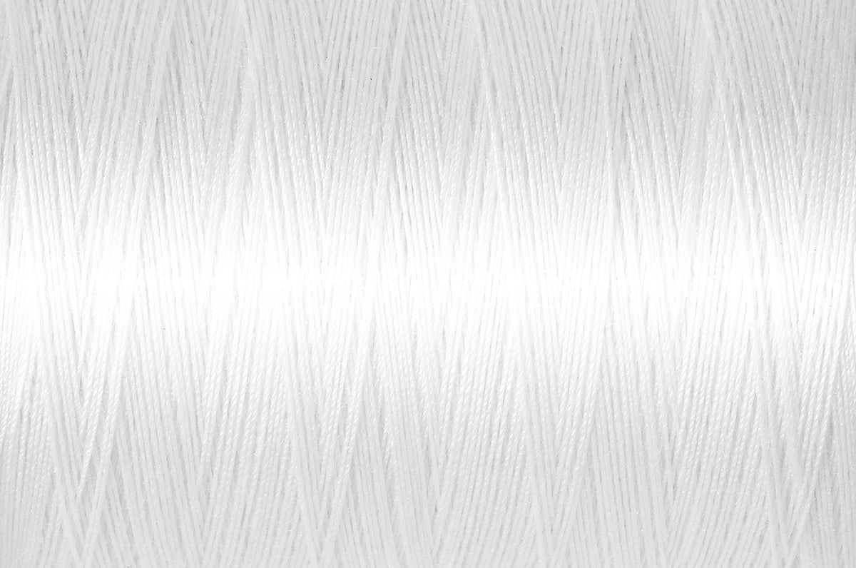 White spool of Gutermann natural cotton thread