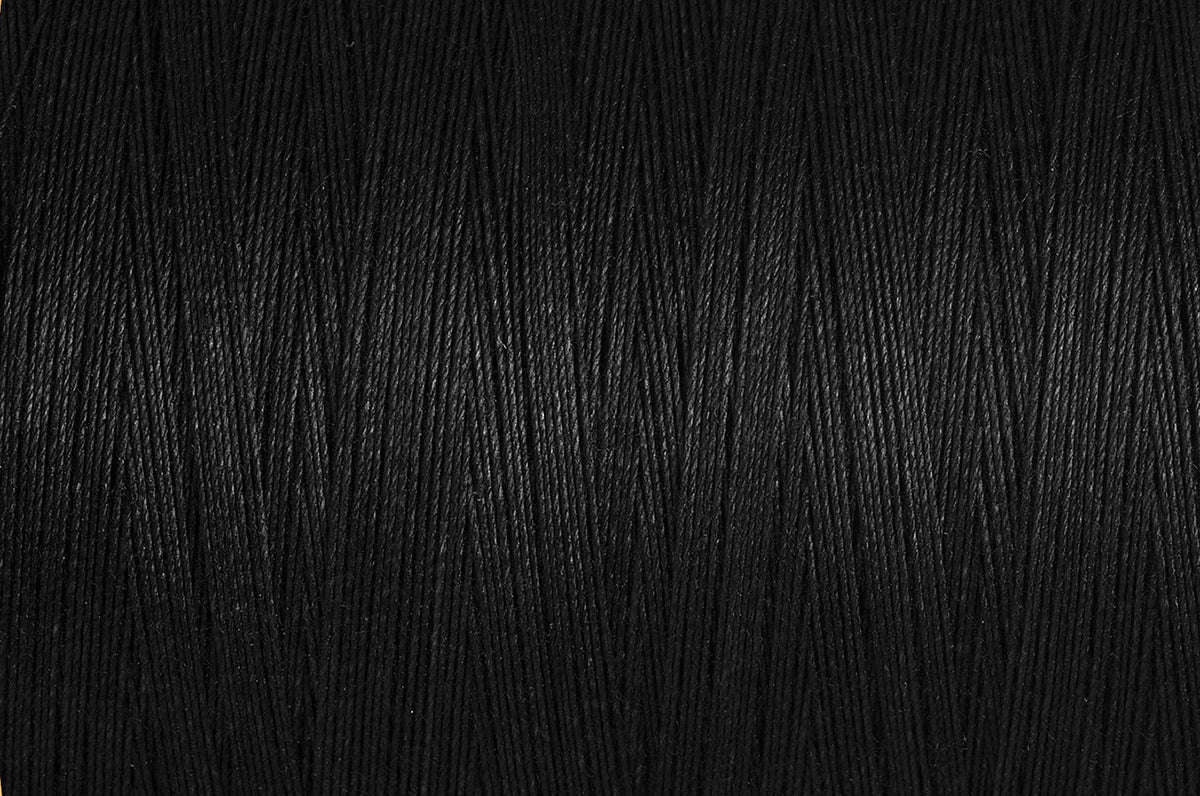 Black spool of Gutermann natural cotton thread