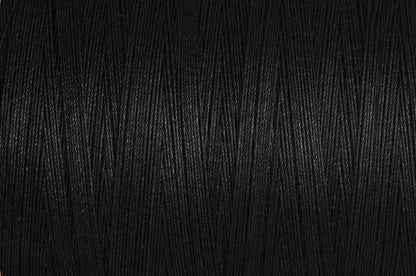 Black spool of Gutermann natural cotton thread