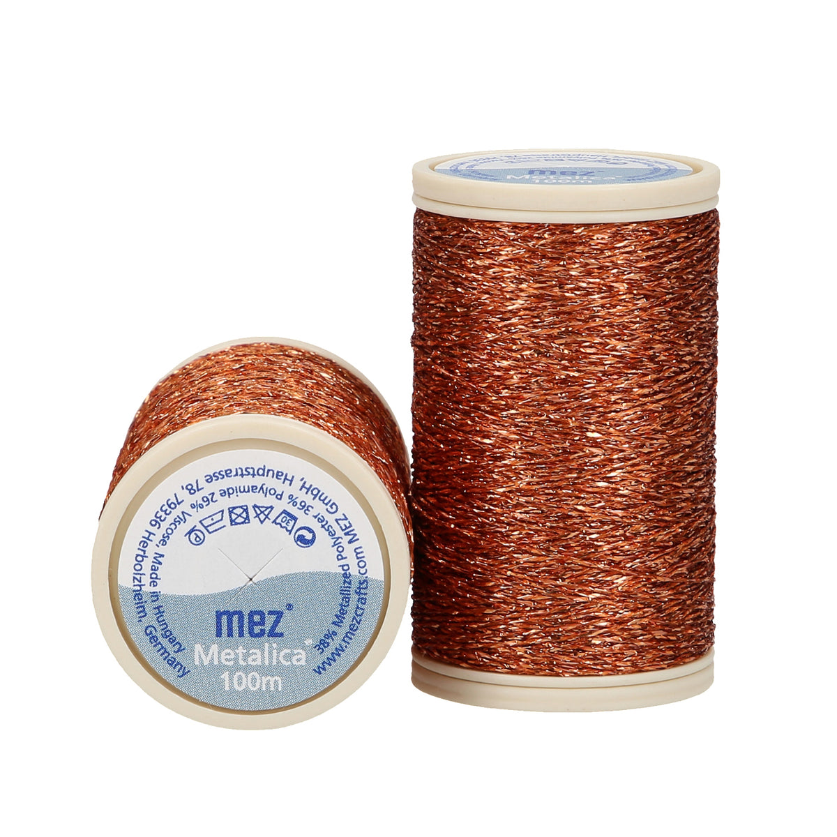 Close-up of copper metallic thread wound on a spool