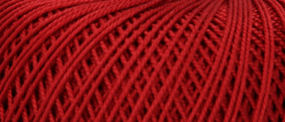 Ball of Puppets Eldorado No. 6 cotton yarn in dark red