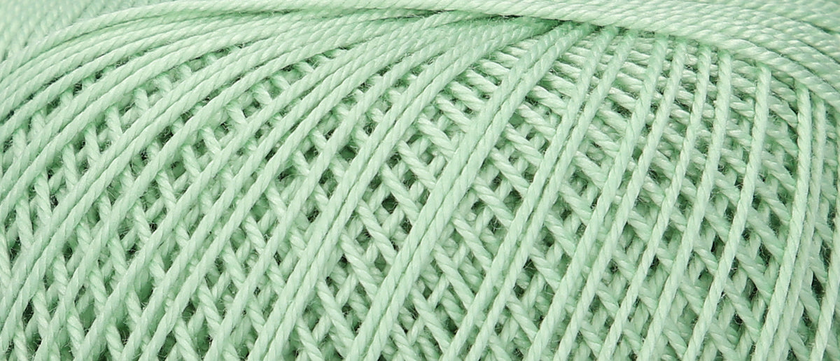 Ball of Puppets Eldorado No 6 cotton yarn in pale green
