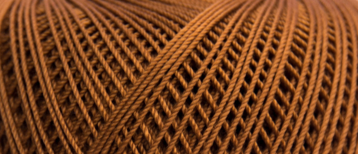 Ball of Puppets Eldorado No 10 cotton yarn in rust