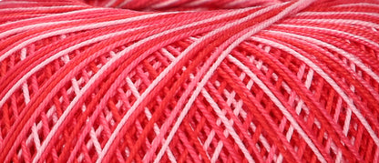 Ball of variegated red Puppets Eldorado cotton crochet thread
