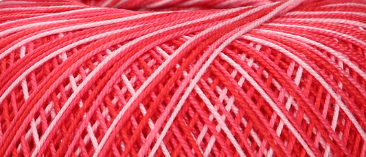 Ball of variegated red Puppets Eldorado cotton crochet thread