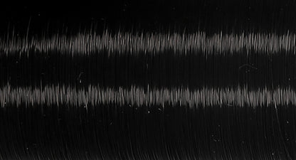 Spool of dark translucent Coats Invisible thread
