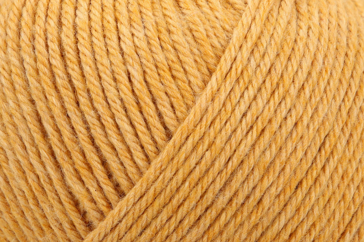Ball of amber Anchor Cotton 'n' Wool 4 ply yarn