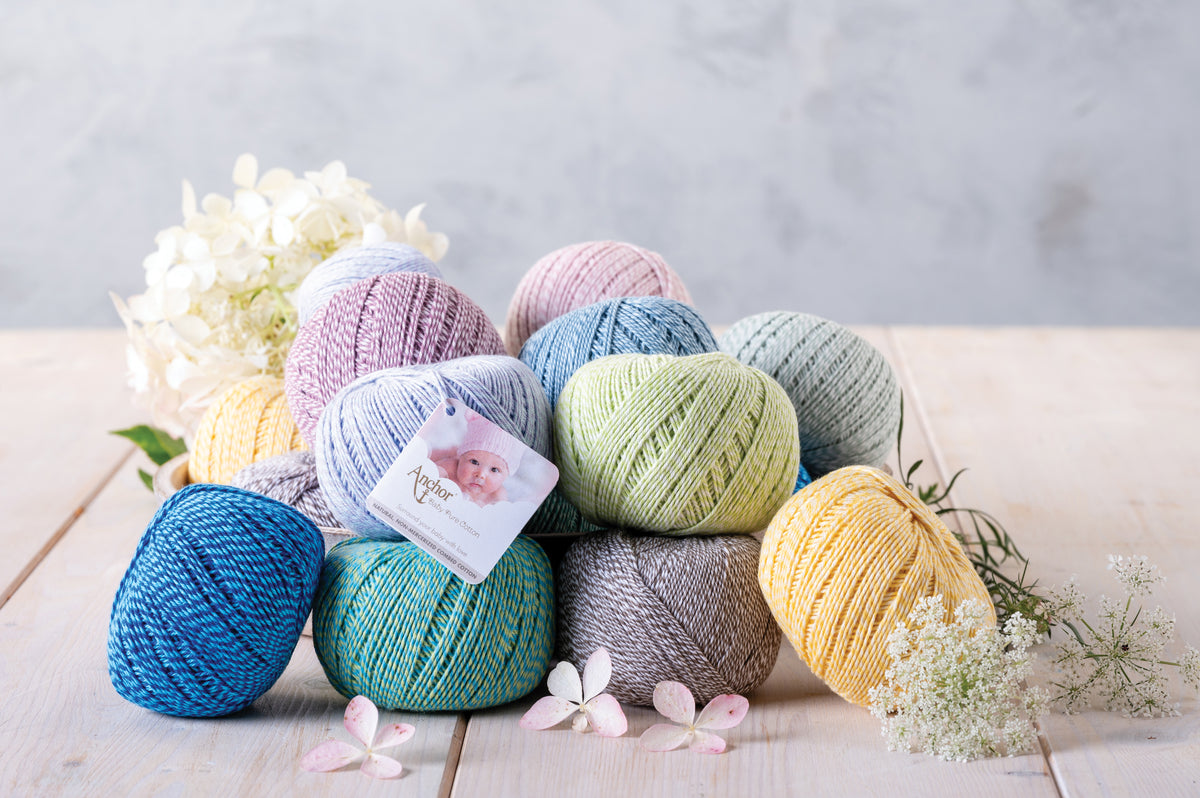 Ball of Anchor Baby Pure Cotton yarn in spotty lollypop