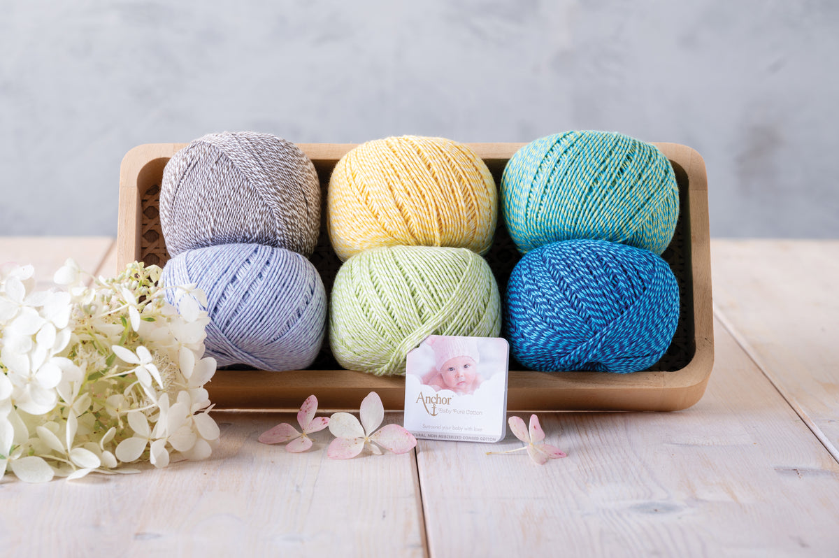 Ball of Anchor Baby Pure Cotton yarn in spotty lollypop