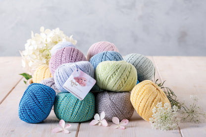 Ball of Anchor Baby Pure Cotton 4 ply yarn in Creamy Lime