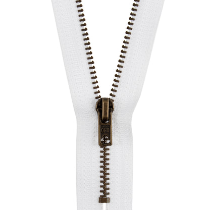 White closed end zip with antique gold metal teeth