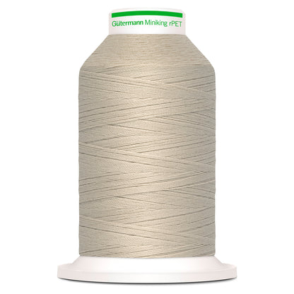 Spool of cream Gutermann Miniking recycled overlocker thread