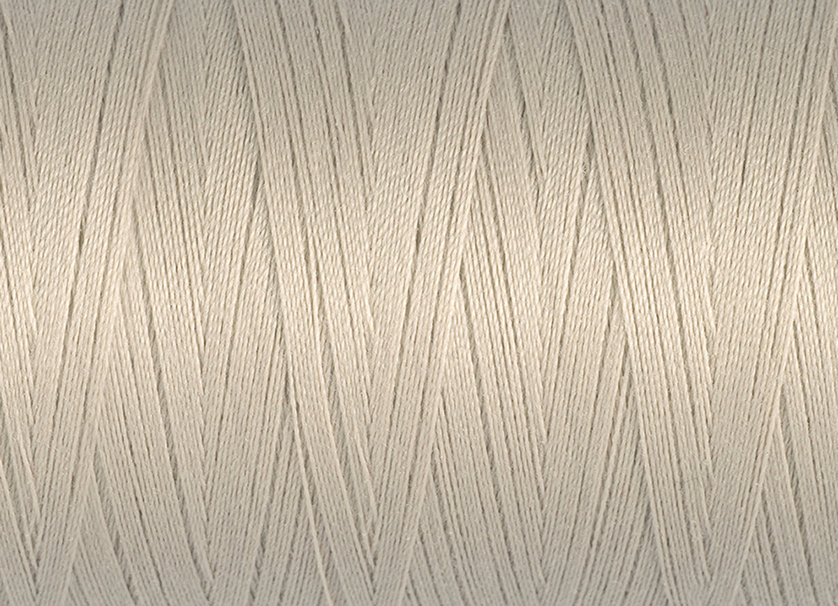 Spool of cream Gutermann Miniking recycled overlocker thread