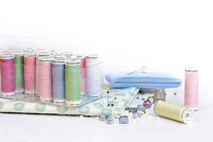 Gutermann clear acrylic thread box with lid holding spools of sewing thread