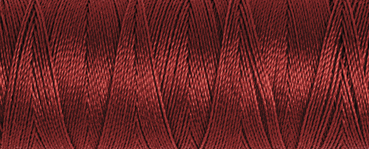 Spool of dark red Gutermann Maraflex elastic sewing thread