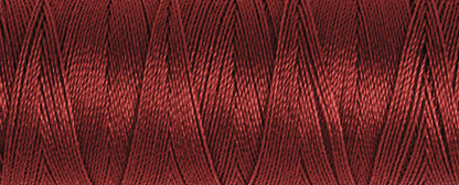 Spool of dark red Gutermann Maraflex elastic sewing thread