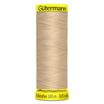Spool of fawn Gutermann Maraflex elastic sewing thread