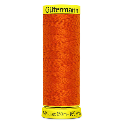 Spool of dark orange Gutermann Maraflex elastic sewing thread