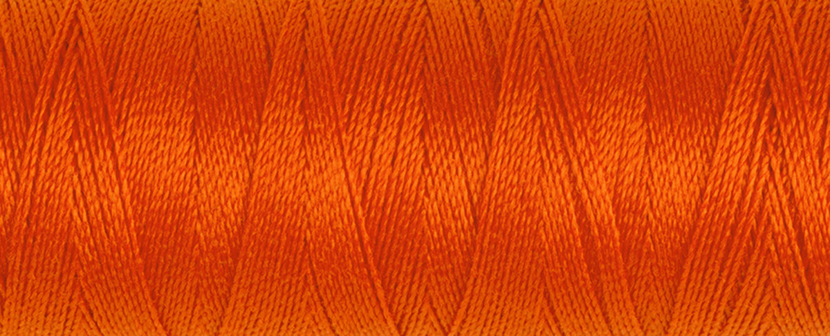Spool of dark orange Gutermann Maraflex elastic sewing thread
