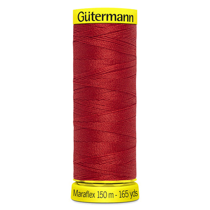 Spool of Gutermann Maraflex elastic thread in brick red
