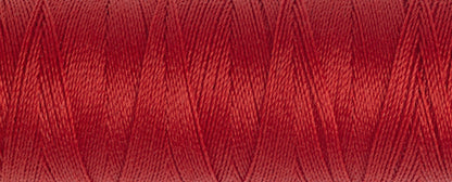 Spool of Gutermann Maraflex elastic thread in brick red
