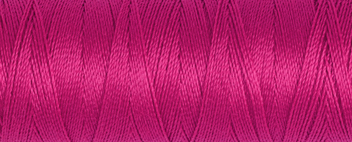 Spool of Gutermann Maraflex elastic thread in bright crimson