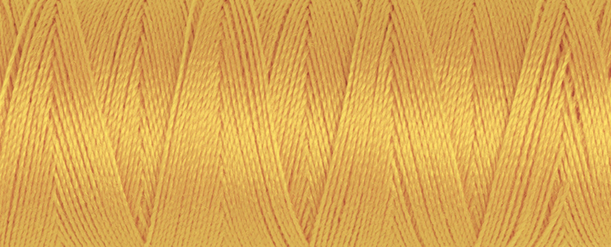 Spool of honey Gutermann Maraflex elastic sewing thread