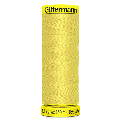 Spool of yellow Gutermann Maraflex elastic sewing thread